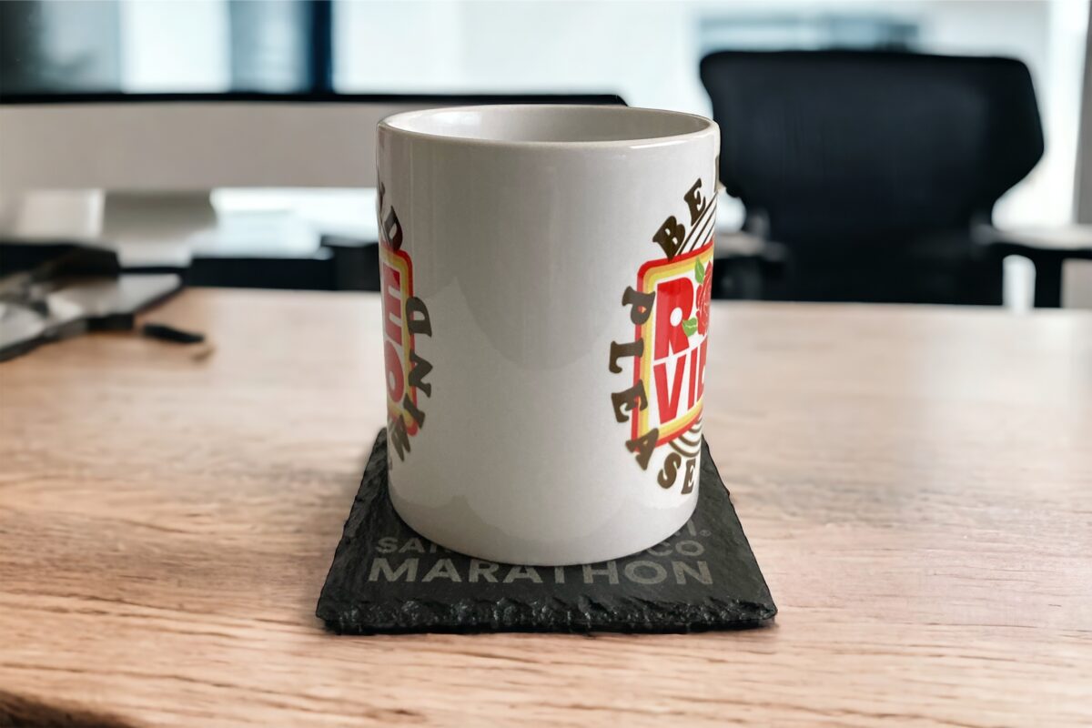 Slate coaster on desk with white mug